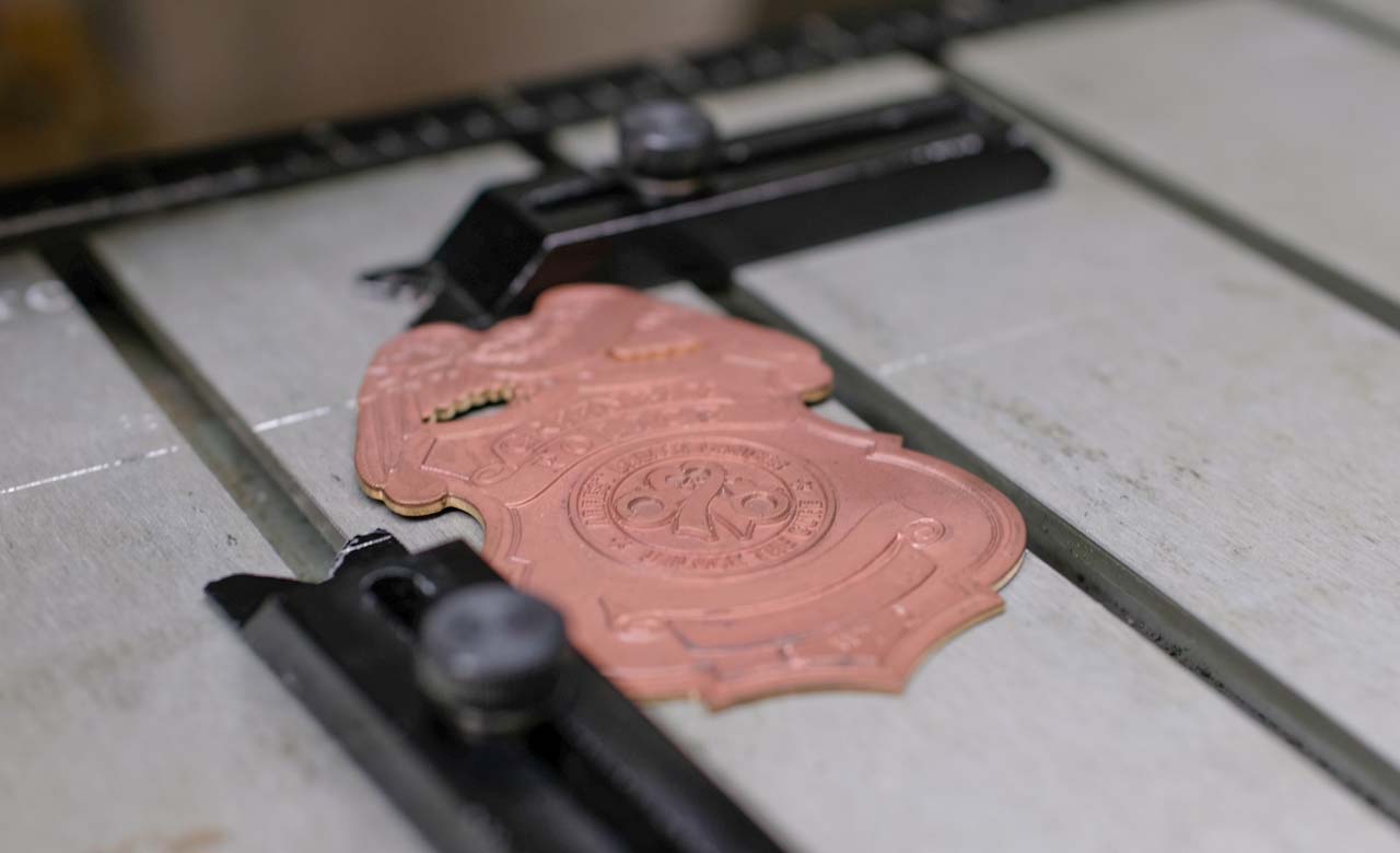 Badge being engraved